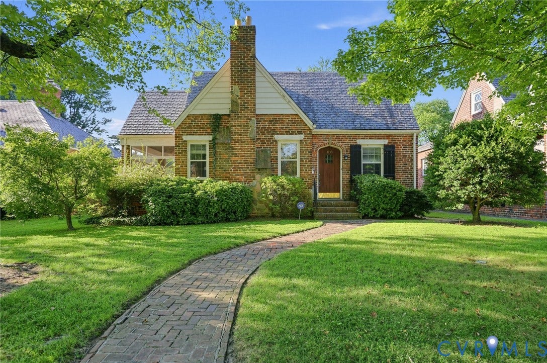 1713 Wilmington Avenue, Richmond, VA 23227 Brick exterior with an arched entryway and dark shutters