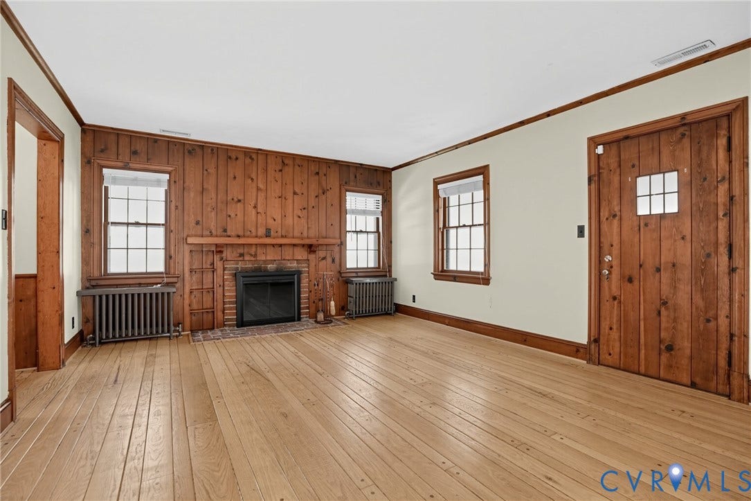 1713 Wilmington Avenue, Richmond, VA 23227 Wood-paneled wall with an integrated brick fireplace