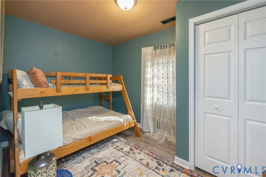 2127 Wright Avenue, Bellemeade, Richmond, VA 23224 Wood-finish flooring, white bi-fold closet doors, and recessed lighting