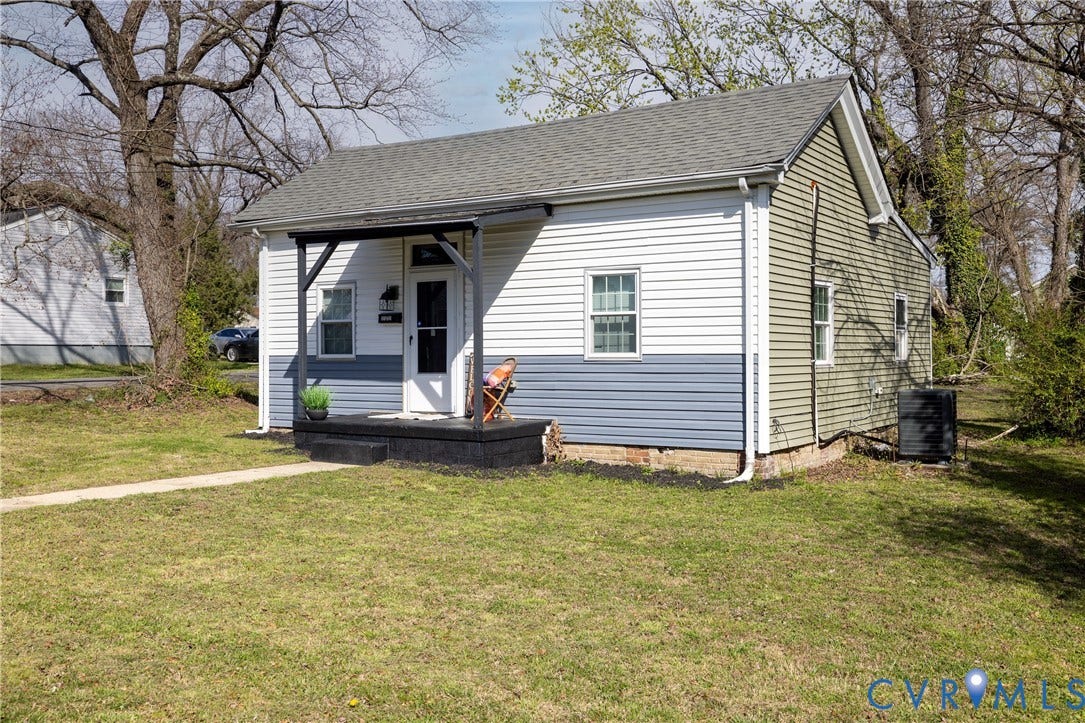 2127 Wright Avenue, Bellemeade, Richmond, VA 23224 Exterior siding in two-tone white and blue, featuring a covered front porch with dark wood-finish columns