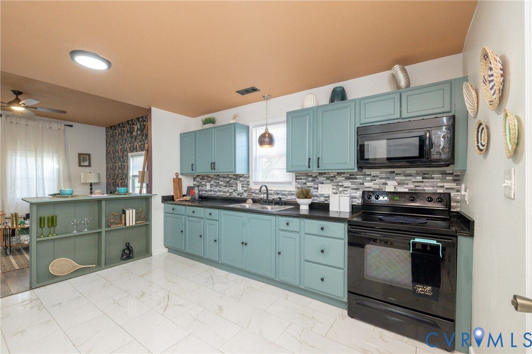 2127 Wright Avenue, Bellemeade, Richmond, VA 23224 Kitchen featuring teal cabinetry, dark countertops, a mosaic tile backsplash, black appliances, and white tile flooring