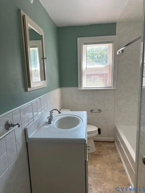 3311 Lanceor Drive, Henrico, VA 23060 White tile wainscoting with a painted wall finish