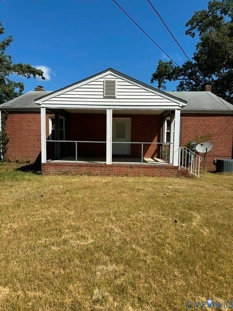 3311 Lanceor Drive, Henrico, VA 23060 Brick exterior featuring a covered porch with white railing