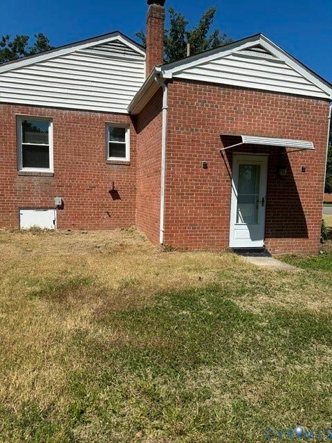3311 Lanceor Drive, Henrico, VA 23060 Brick exterior construction featuring white siding gables and a brick chimney