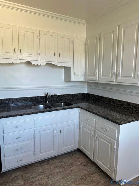 3311 Lanceor Drive, Henrico, VA 23060 Kitchen featuring white cabinetry, dark stone-finish countertops, and a dual basin stainless steel sink