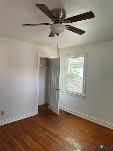 3311 Lanceor Drive, Henrico, VA 23060 Hardwood flooring, ceiling fan with integrated lighting, white trim, single window with blinds, and a built-in closet with shelving