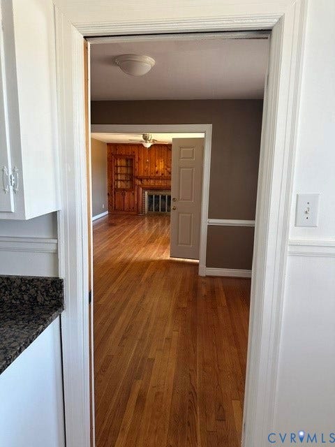 3311 Lanceor Drive, Henrico, VA 23060 Wood-finish flooring throughout, white cabinetry with dark hardware, stone-finish countertop, and white trim work