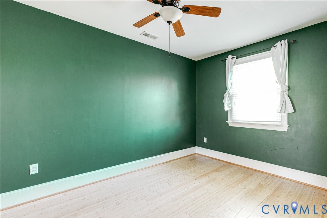 1311 N 33rd Street, Oakwood, Richmond, VA 23223 Wood-finish flooring, white window trim, and a ceiling fan with light fixture