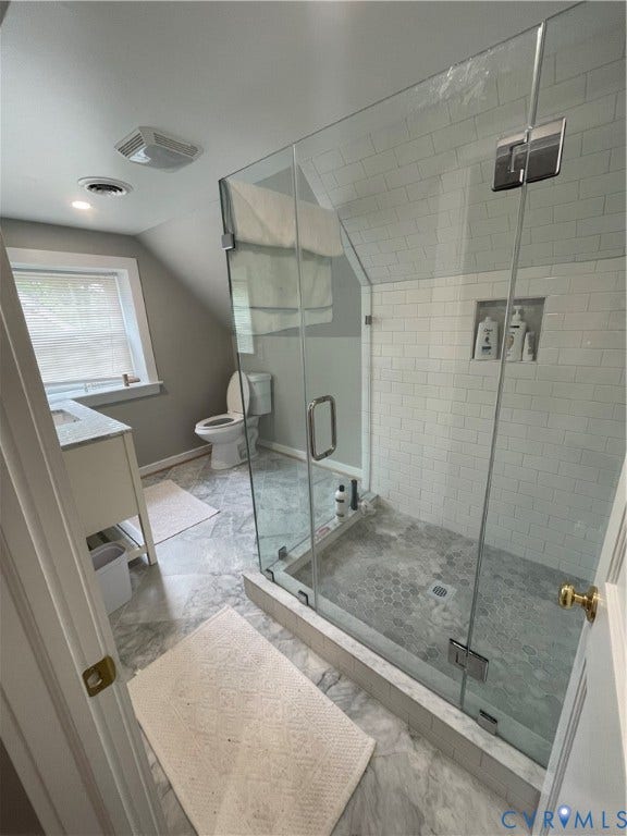 4403 Park Avenue, Richmond, VA 23221 Glass-enclosed shower with subway tile surround and hexagonal floor tiles