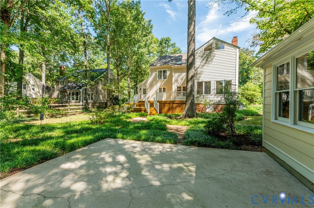 11211 Warren View Road, Henrico, VA 23233 Expansive concrete patio with lush green landscaping