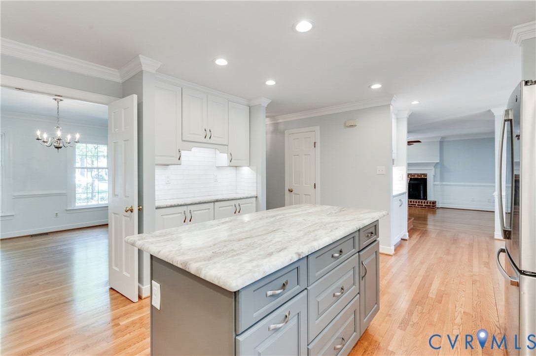 11211 Warren View Road, Henrico, VA 23233 Kitchen island with a light-toned countertop and gray cabinetry