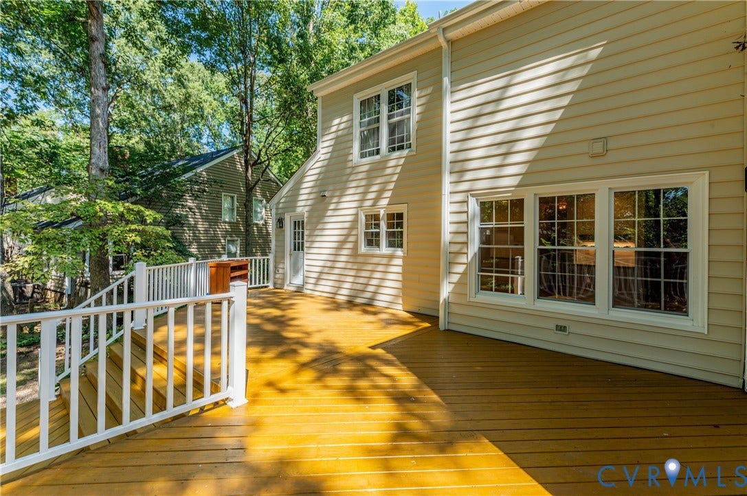 11211 Warren View Road, Henrico, VA 23233 Expansive exterior deck with wood-finish flooring and white railings