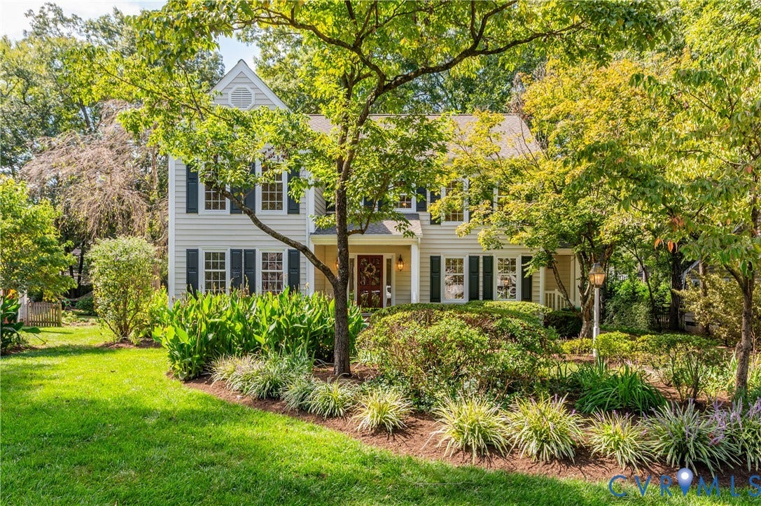11211 Warren View Road, Henrico, VA 23233 Two-story residence featuring light-colored siding, dark shutters, a covered front porch, and a dormer window