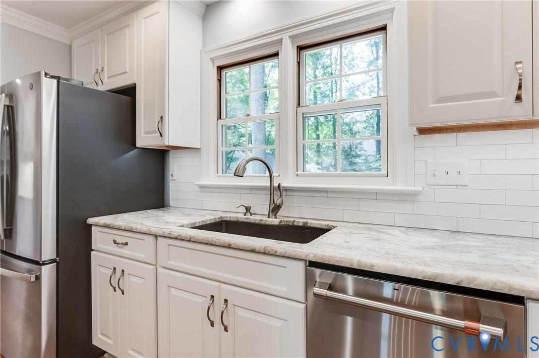 11211 Warren View Road, Henrico, VA 23233 White shaker-style cabinetry, stainless steel appliances, undermount sink, stone countertop, and subway tile backsplash
