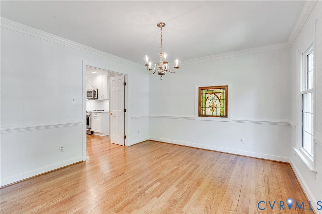 11211 Warren View Road, Henrico, VA 23233 Hardwood flooring, decorative chandelier, stained glass window, crown molding, and chair rail detailing