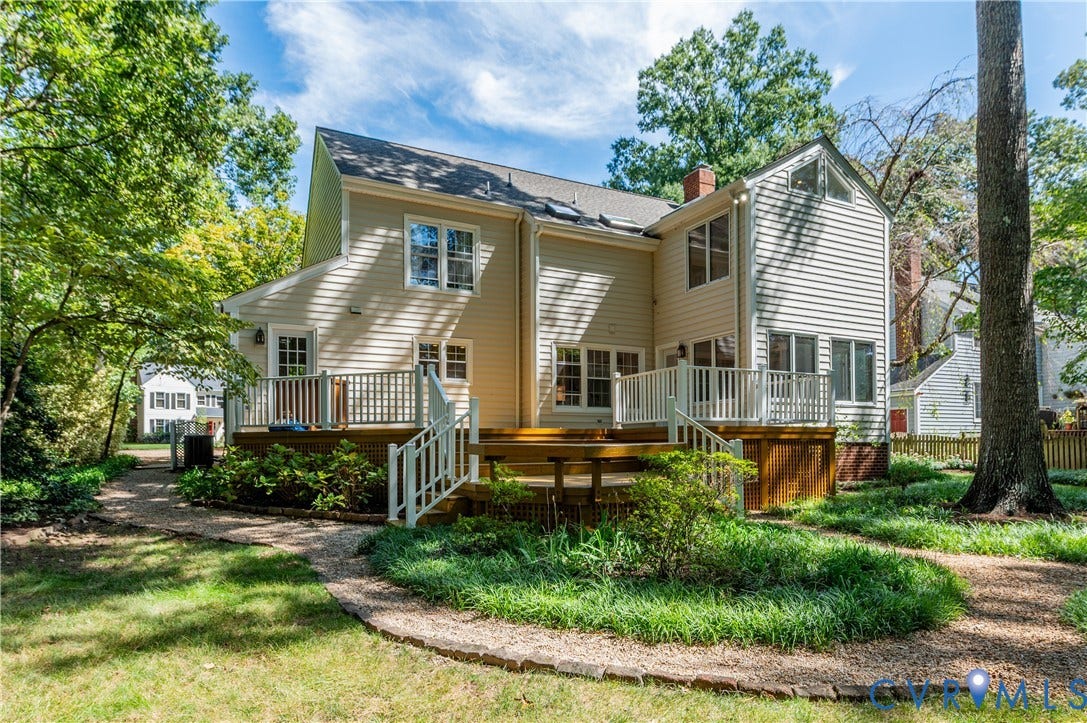 11211 Warren View Road, Henrico, VA 23233 Multi-level wood deck with white railings, a brick chimney, and mature surrounding trees