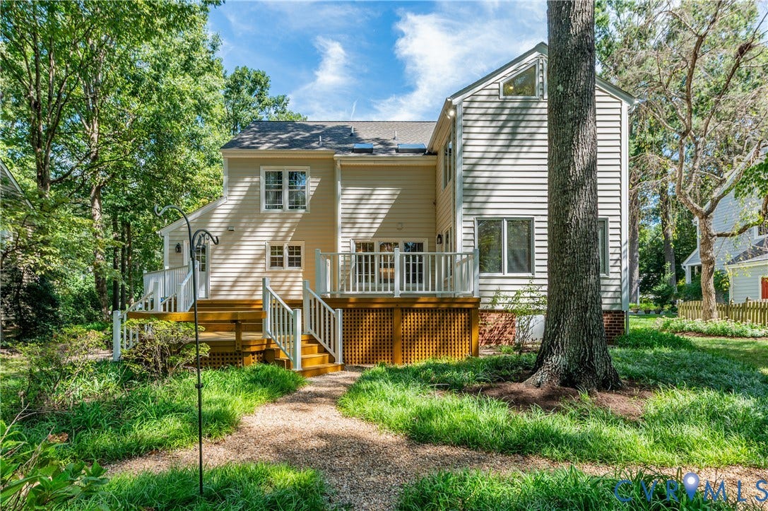 11211 Warren View Road, Henrico, VA 23233 Multi-level deck with white railings, light-colored siding, and a gravel path