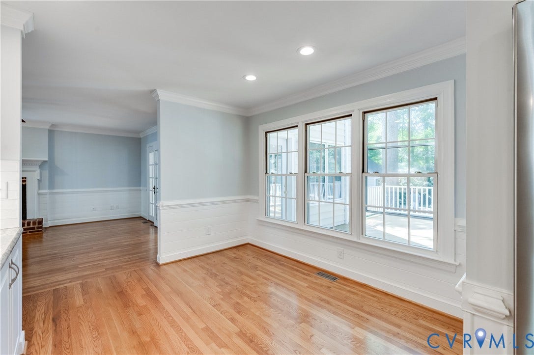 11211 Warren View Road, Henrico, VA 23233 Hardwood flooring throughout, recessed lighting, crown molding, wainscoting, and a wall of windows