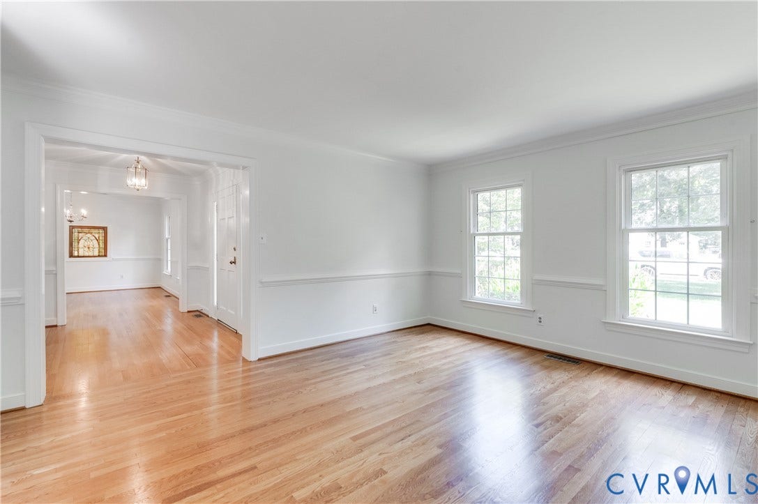 11211 Warren View Road, Henrico, VA 23233 Hardwood flooring, white wall paint, chair rail molding, crown molding, and double-hung windows