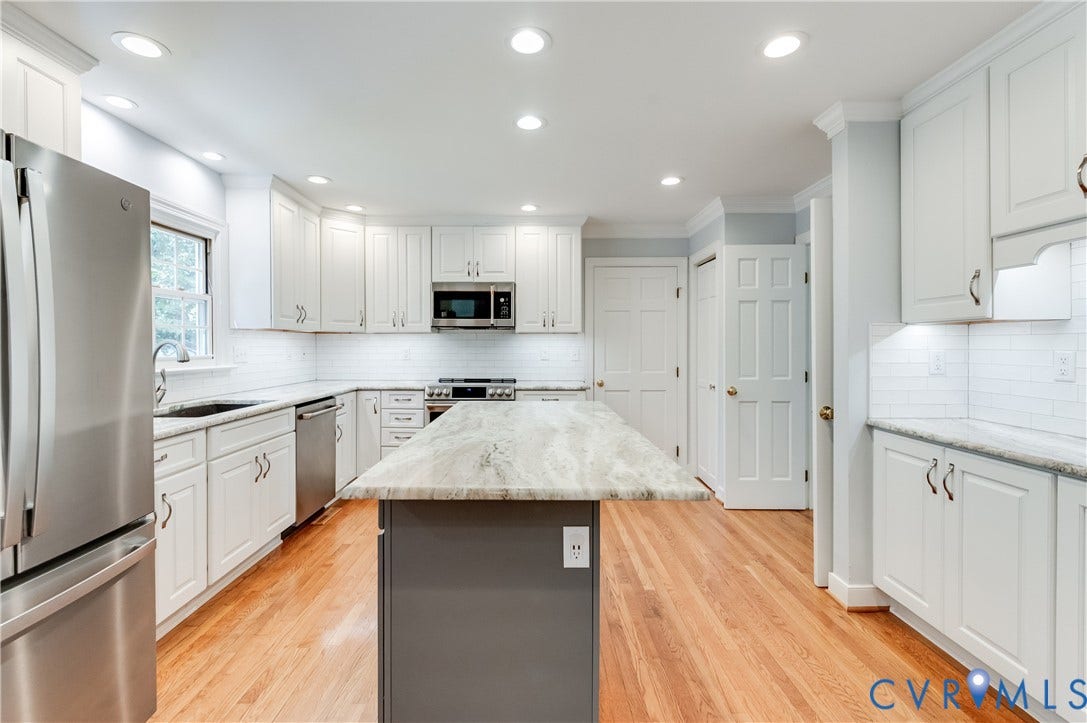 11211 Warren View Road, Henrico, VA 23233 Kitchen featuring white cabinetry, stainless steel appliances, a center island with a light-toned countertop, hardwood flooring, and recessed lighting