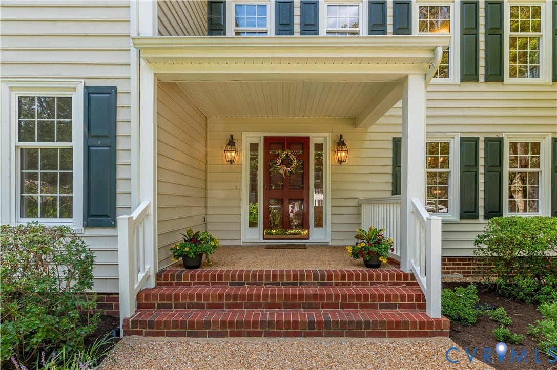 11211 Warren View Road, Henrico, VA 23233 Covered porch entry featuring brick steps, an exposed aggregate landing, and dual decorative sconces