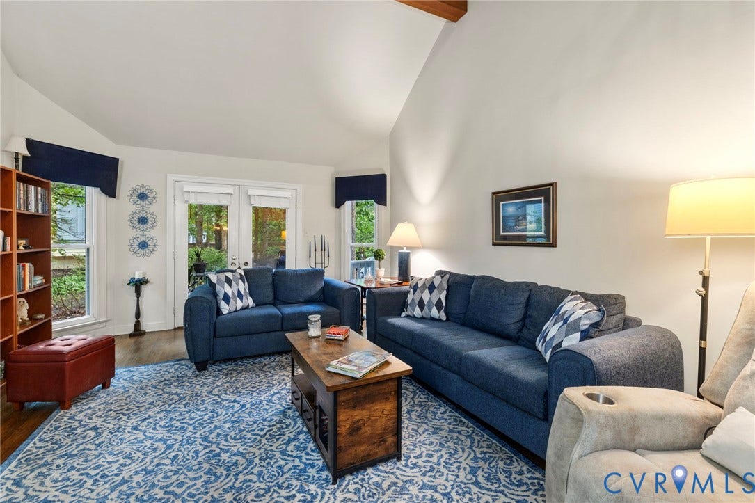 11805 Bedfordshire Square, Henrico, VA 23238 Vaulted ceiling with exposed wood beam, wood flooring, and double French doors to the exterior