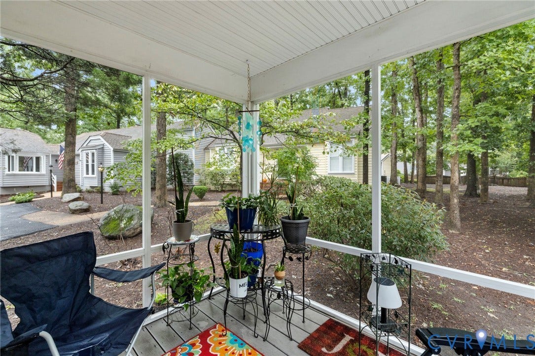11805 Bedfordshire Square, Henrico, VA 23238 Screened porch with decking and white frame, overlooking a wooded landscape