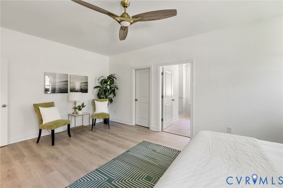 12506 Ashton Dell Road, Chester, VA 23831 Spacious room with wood-finish flooring, a contemporary ceiling fan, and a neutral color palette