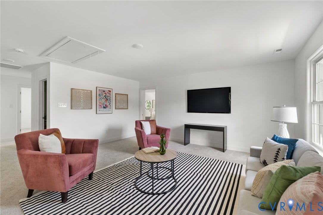 12506 Ashton Dell Road, Chester, VA 23831 Carpeted living area with white walls and recessed lighting