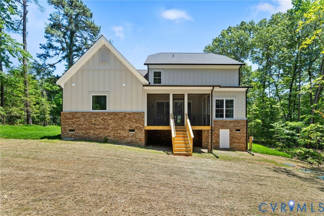 12506 Ashton Dell Road, Chester, VA 23831 Exterior featuring brick, vertical board-and-batten siding, and a screened porch with exterior stairs