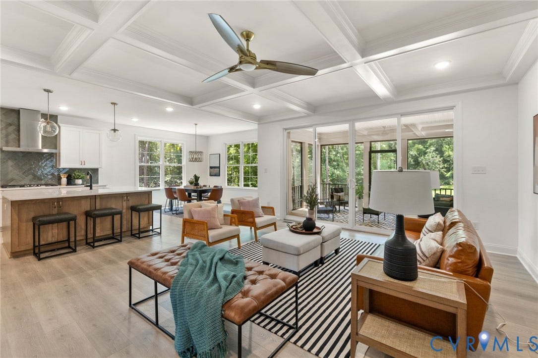 12506 Ashton Dell Road, Chester, VA 23831 Coffered ceilings, wood-finish flooring, and a modern kitchen with a large island