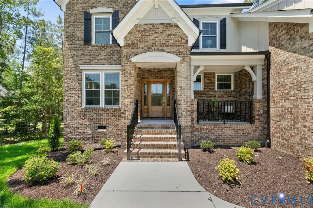 12506 Ashton Dell Road, Chester, VA 23831 Brick exterior with white trim and dark shutters