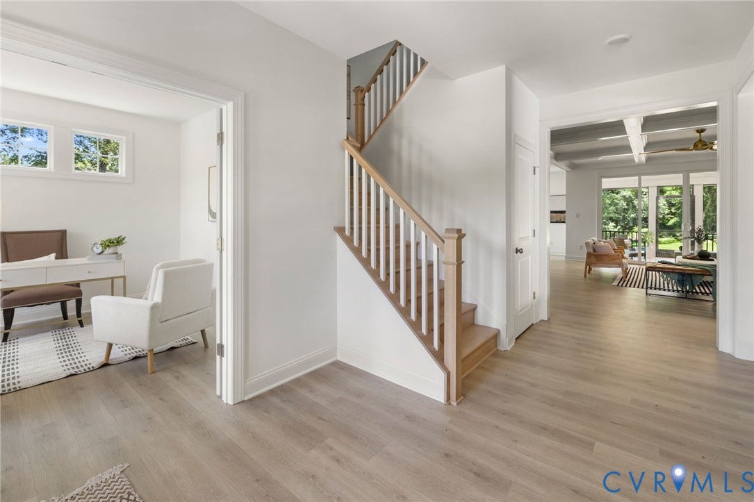 12506 Ashton Dell Road, Chester, VA 23831 Wood-finish flooring throughout, staircase with wood newel post and railings, recessed lighting, white trim, and multiple windows