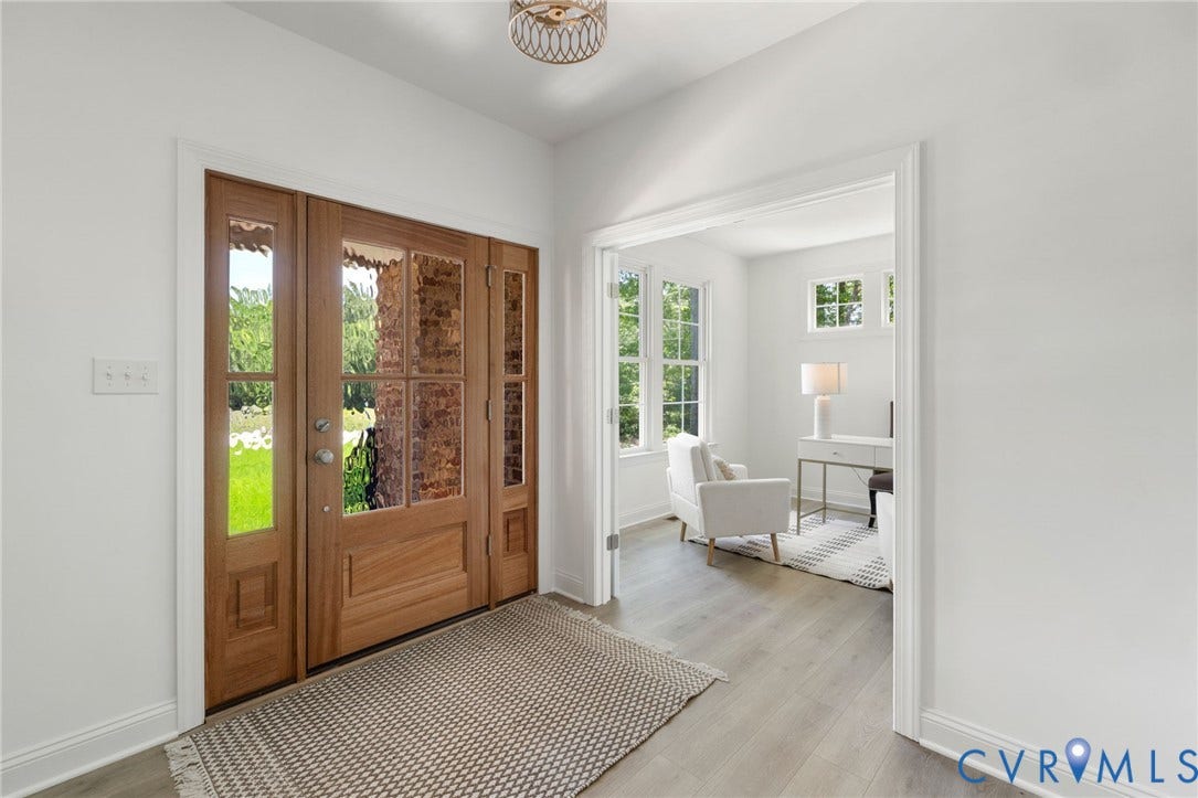 12506 Ashton Dell Road, Chester, VA 23831 Wood-finish flooring, white walls, and a decorative semi-flush mount light fixture