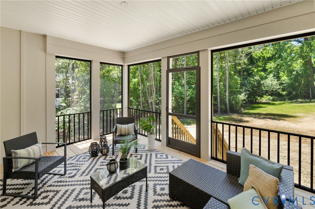 12506 Ashton Dell Road, Chester, VA 23831 Screened porch with wood-finish flooring, black balusters, and a paneled ceiling