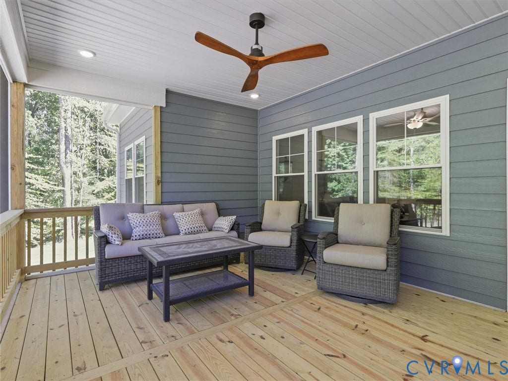 3102 Kensington Lane, Goochland, VA 23063 Covered porch featuring wood-finish flooring, plank siding, and a wooden ceiling fan
