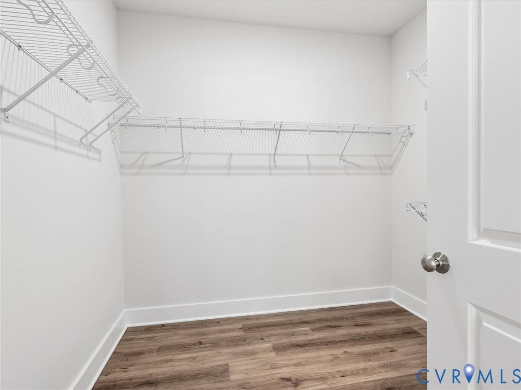 3102 Kensington Lane, Goochland, VA 23063 Wood-finish flooring with white baseboards, white walls, and white wire shelving