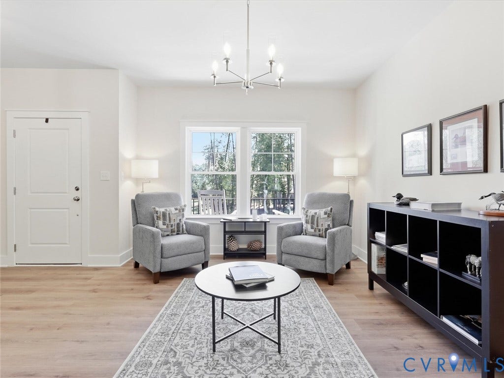 3102 Kensington Lane, Goochland, VA 23063 Recessed lighting, wood-finish flooring, white trim details, and a modern chandelier