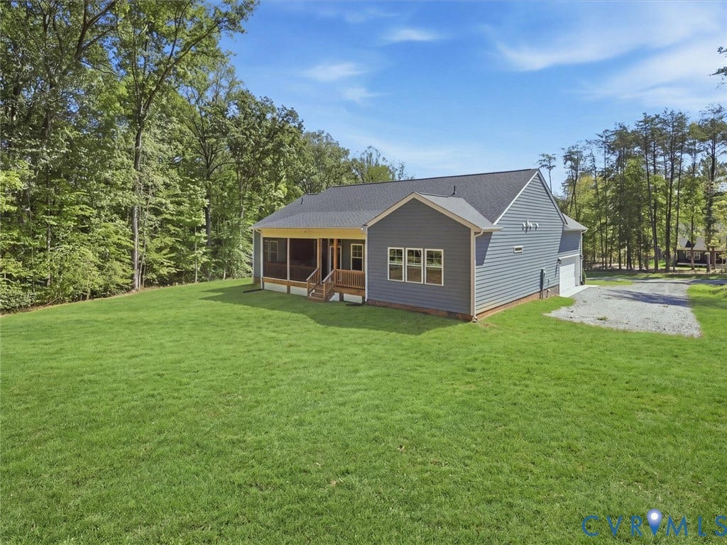 3102 Kensington Lane, Goochland, VA 23063 Spacious green lawn surrounding the home, featuring a screened porch with wood detailing and stairs