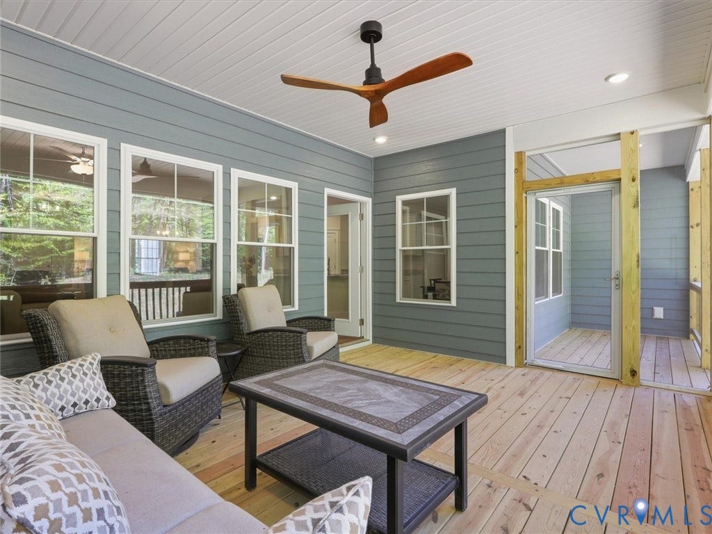 3102 Kensington Lane, Goochland, VA 23063 Expansive screened porch featuring wood-finish flooring, a ceiling fan, recessed lighting, and multiple windows