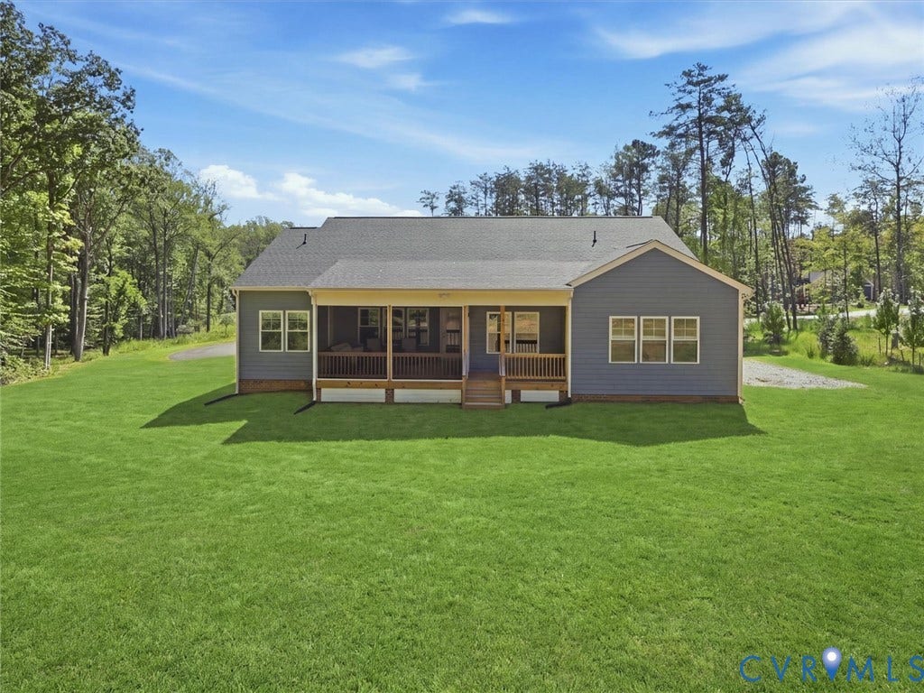 3102 Kensington Lane, Goochland, VA 23063 Expansive rear lawn, screened porch with wood railing, blue siding exterior, multiple windows, and a shingled roof