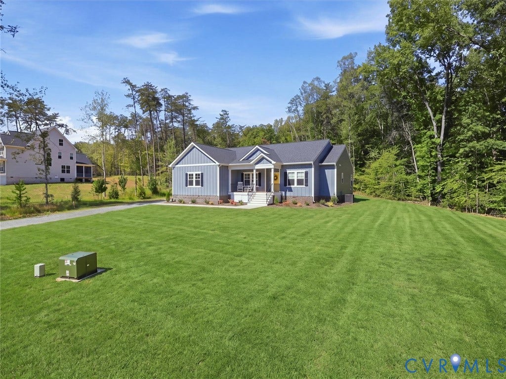 3102 Kensington Lane, Goochland, VA 23063 Light blue siding exterior with dark shutters, white trim, and a dark roof