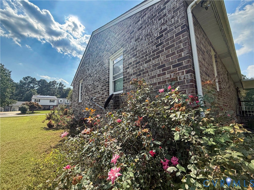 4512 Greenbriar Drive, Chester, VA 23831 Brick exterior with white window trim and white gutters