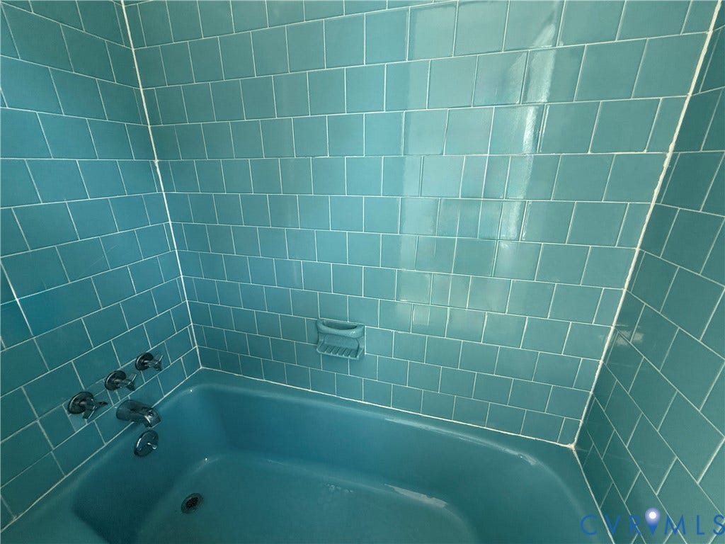 4512 Greenbriar Drive, Chester, VA 23831 Tub and shower surround featuring turquoise-colored tile