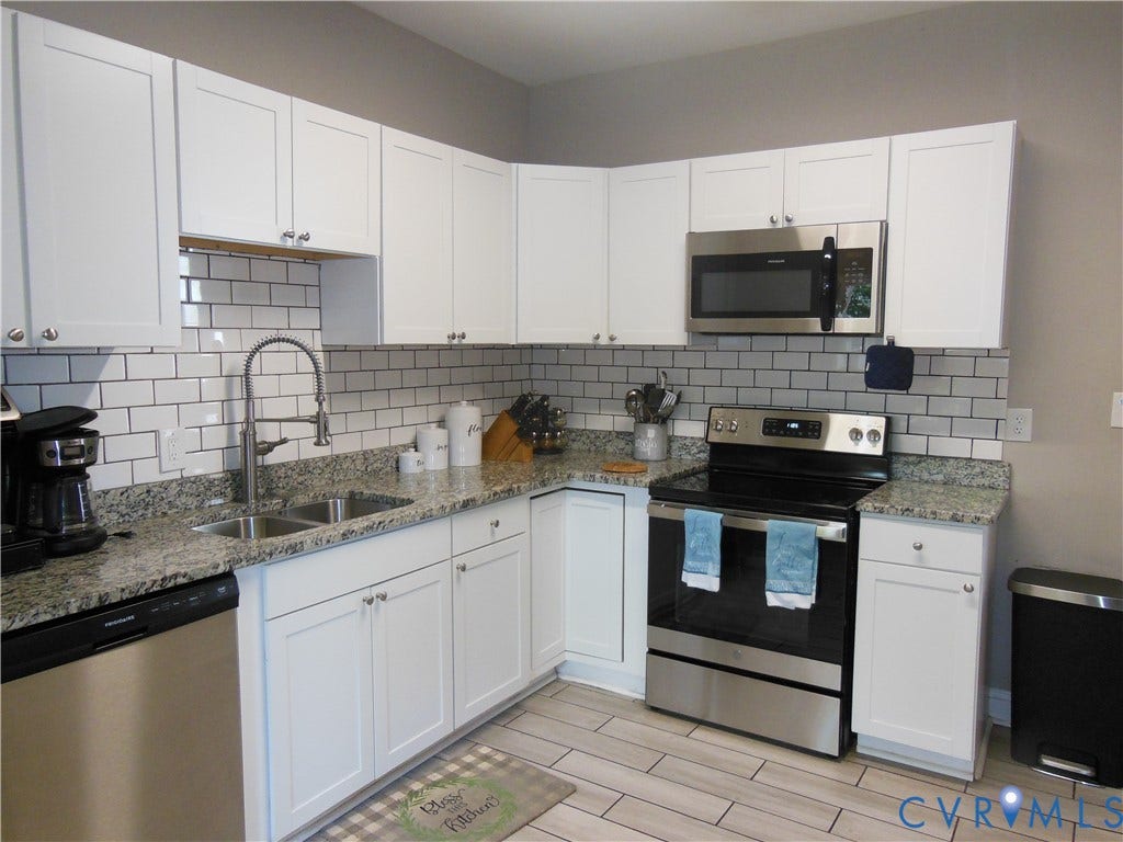 109 Yancey Street, Richmond, VA 23222 With White Cabinetry and Granite Counters. SS Appliances - Electric Range, Microwave, Dishwasher and Refrigerator