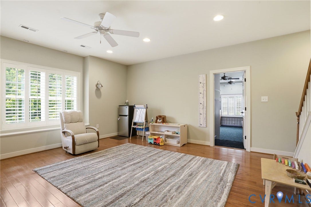 Hardwood-style flooring throughout, ceiling fan with integrated lighting, recessed lighting, and white plantation shutters