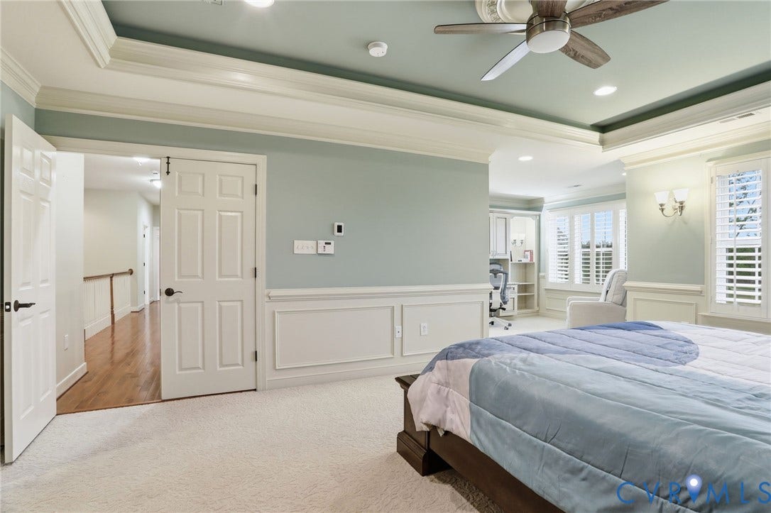 Recessed lighting, ceiling fan, crown molding, wainscoting, and plantation shutters