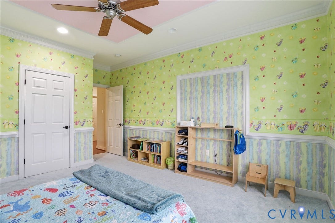 Carpeted flooring, recessed lighting, ceiling fan, crown molding, and two-panel doors
