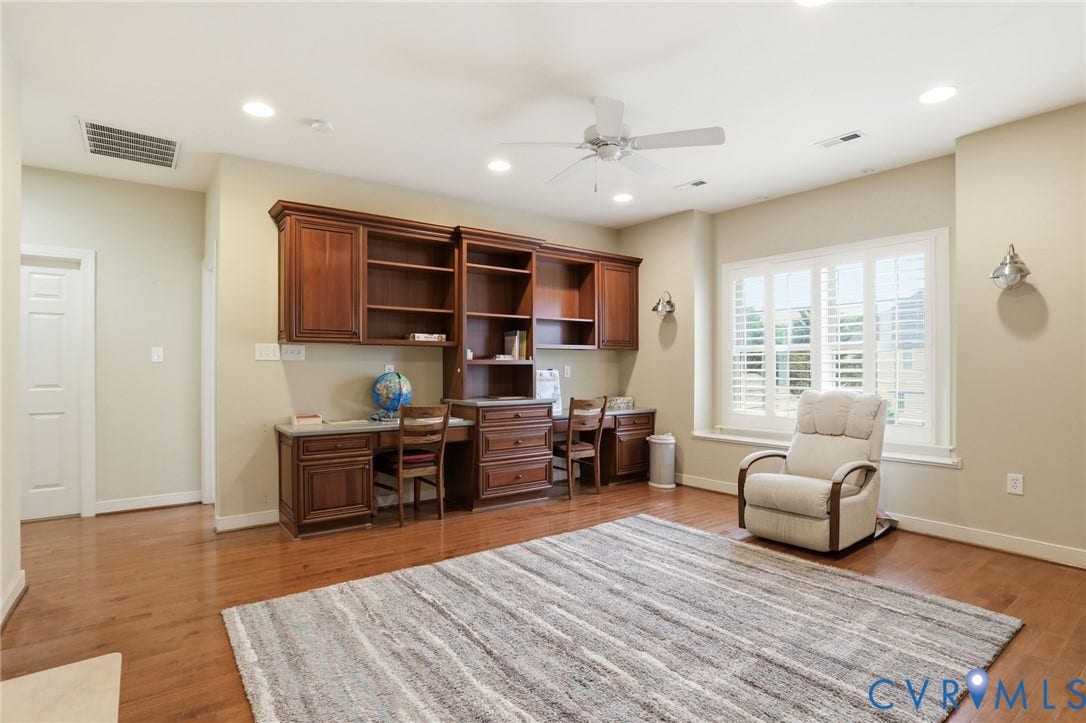 Hardwood flooring, recessed lighting, built-in cabinetry, ceiling fan, and window with plantation shutters