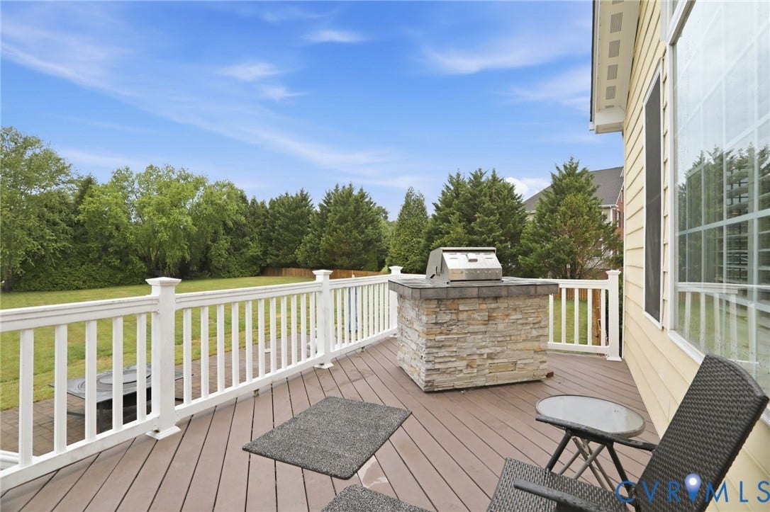 Expansive deck with composite decking and white railings